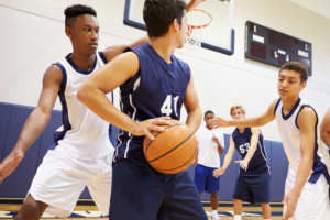 Teens playing basketball | Racine Community Health Center Affordable Sports Physicals Available at Racine Community Health Center